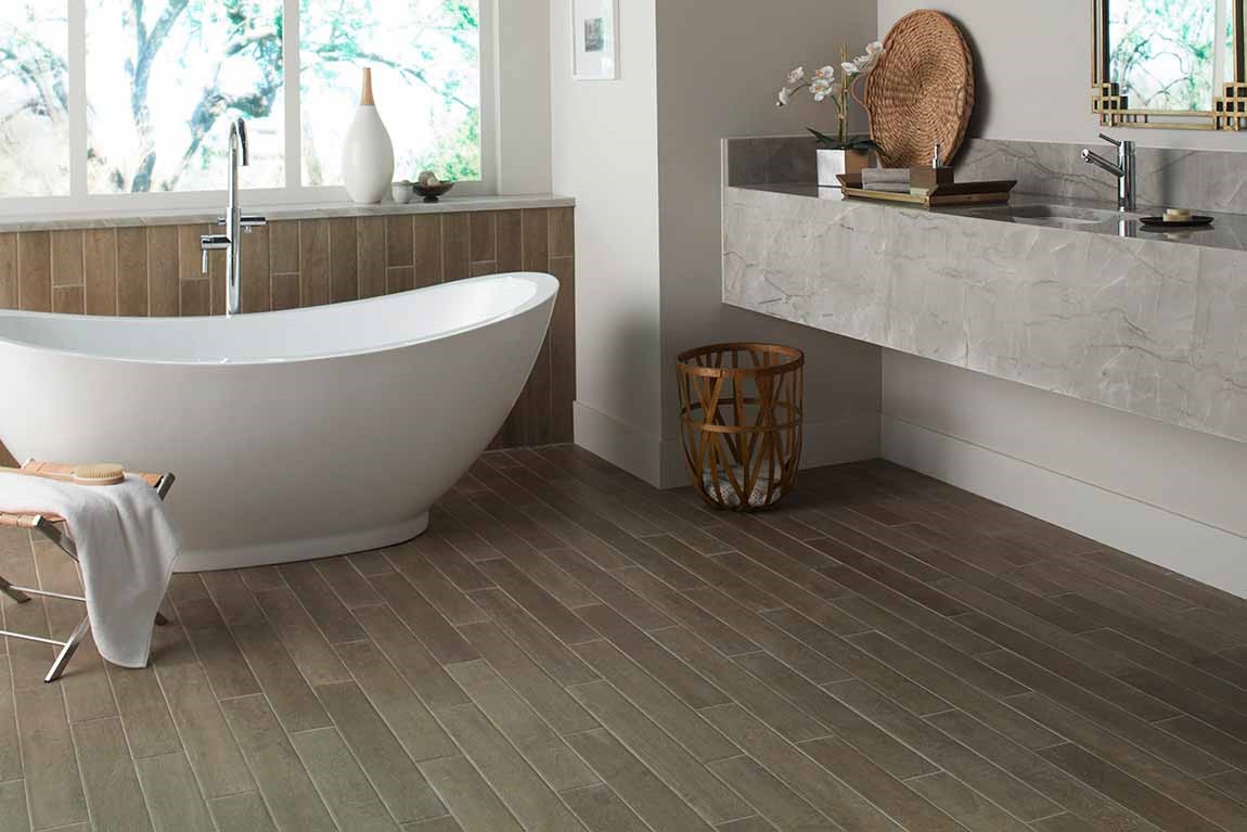 dark tiled bathroom with freestanding tub and floating vanity dark tiled bathroom with freestanding tub and floating vanity